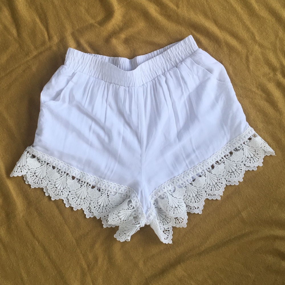 White shorts with thick lace fringe.